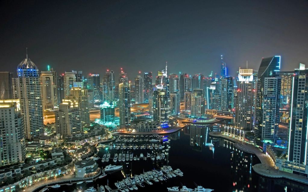 Dubai skyscrapers lit at night